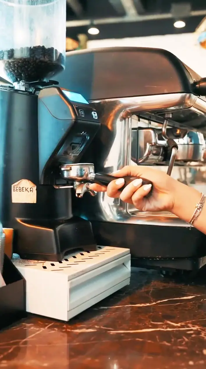 Espresso machine and grinder on the marble counter