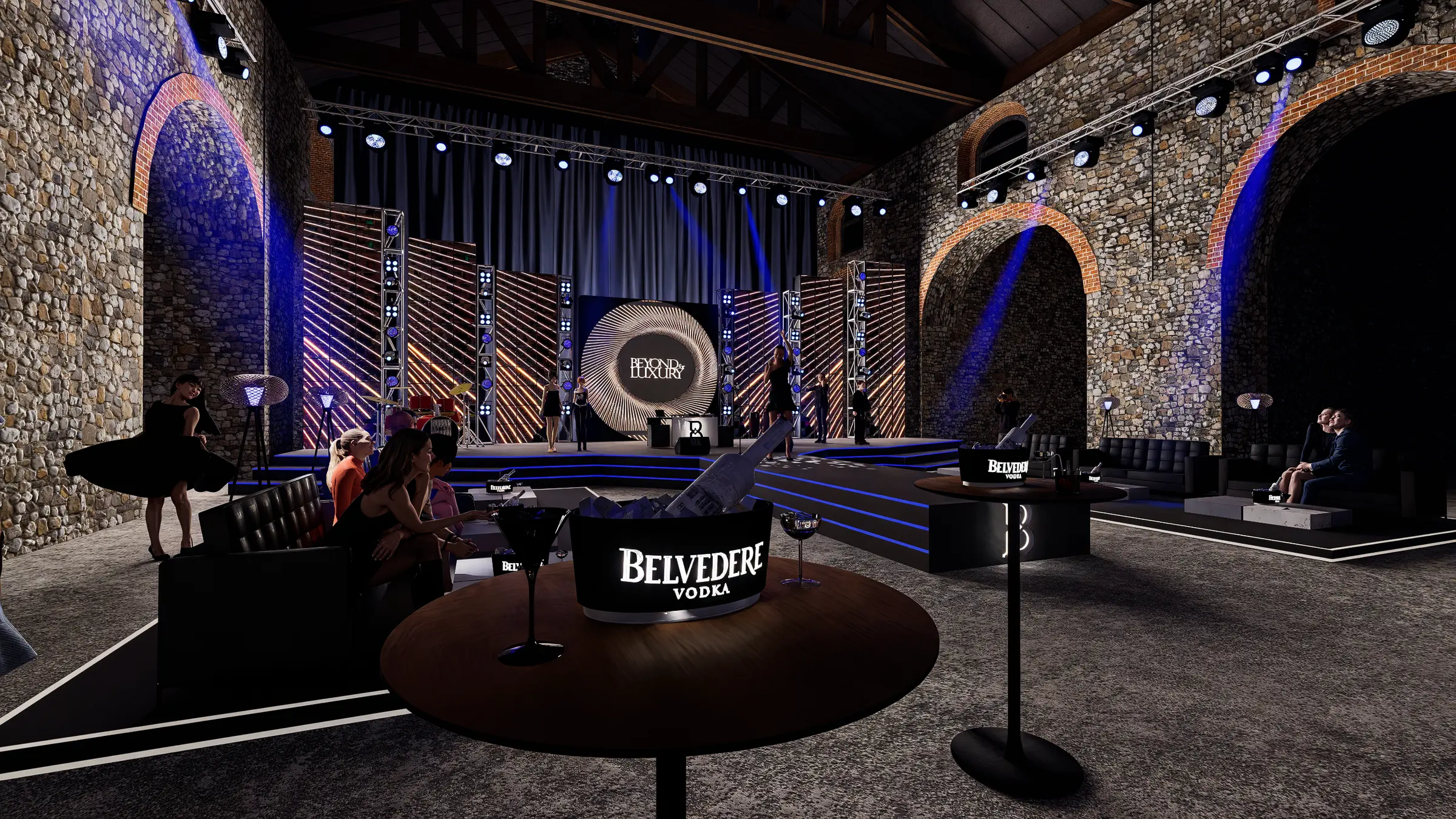 Önde Belvedere masalı VIP lounge, arkada sahne; loş ışık.