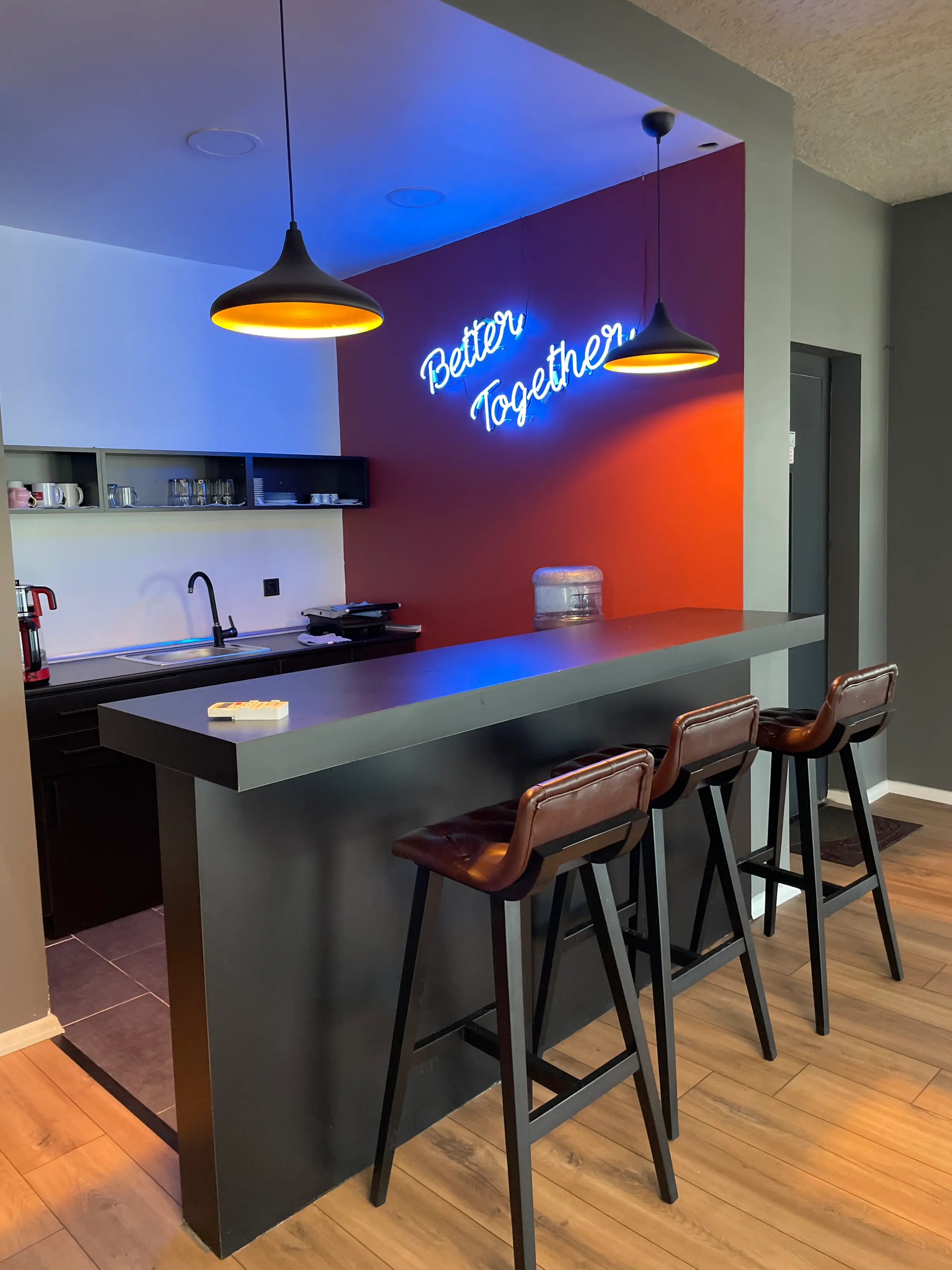 Kitchen bar and “Better Together” neon, seen from above
