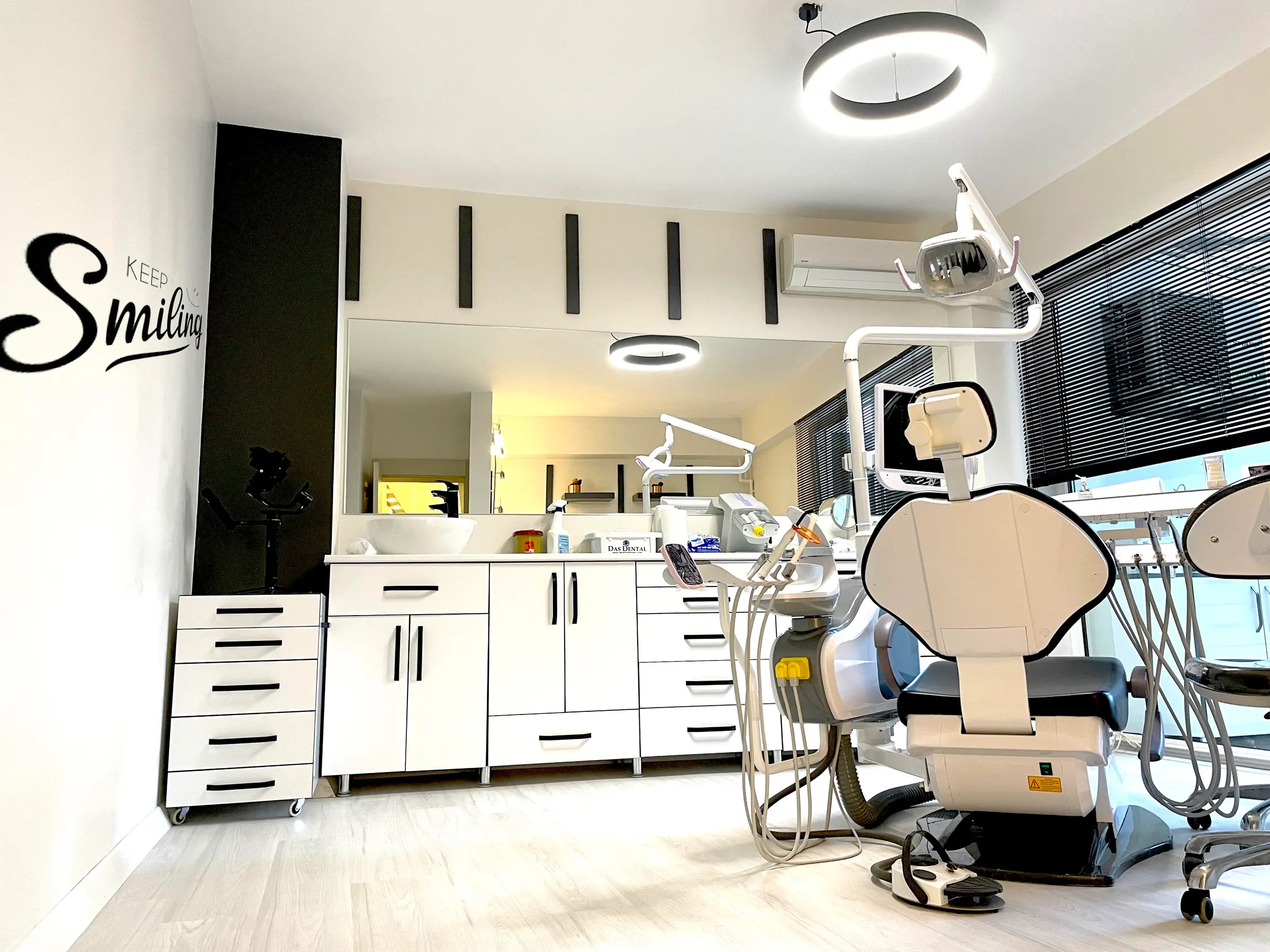 Dental chair, “Keep Smiling” wall lettering and ring LED